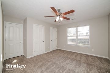 Grantville house for rent - a living room with carpet and a ceiling fan