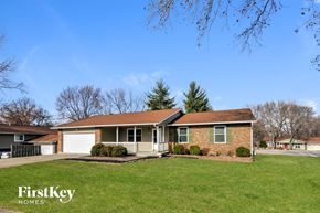 O'fallon house for rent - A house with a lawn in front of it.