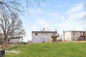 Saint Peters house for rent - a white house on top of a grass covered hill