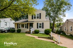 Saint Louis house for rent - A house with a white picket fence in front of it.