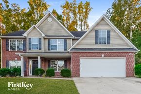 Covington house for rent - a brick house with a white garage door
