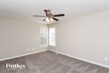 Fuquay Varina house for rent - the spacious living room with ceiling fan and carpet