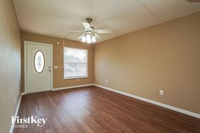 North Fort Myers house for rent - A room with a white door and a window with a view of a parking lot.