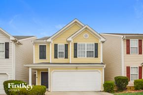 Covington house for rent - A house with a garage door is for sale by FirstKey Homes.