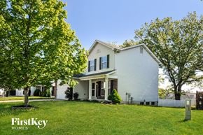 O'fallon house for rent - a white house with a yard and trees