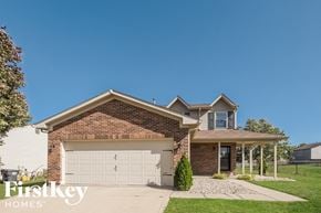 Greenwood house for rent - a brick house with a white garage door