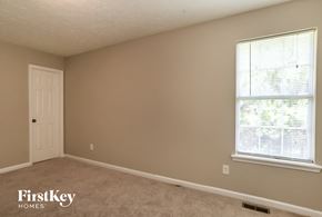 Rockmart house for rent - a bedroom with a window and a white door