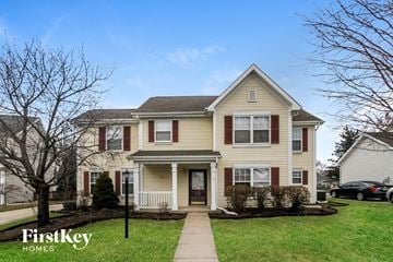 Brownsburg house for rent - a yellow house with red shutters and a sidewalk in front