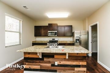 Dallas house for rent - an updated kitchen with granite countertops and stainless steel appliances