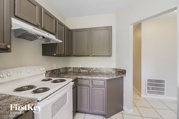 Sebastian house for rent - a kitchen with a stove top oven and a counter top