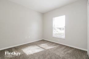 Sebastian house for rent - a bedroom with carpet and a window