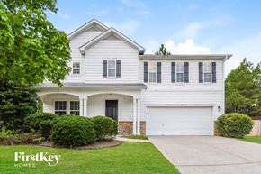 Dallas house for rent - a white house with black shutters and a driveway