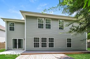 Summerville house for rent - A modern house with a grey exterior and a wooden deck.