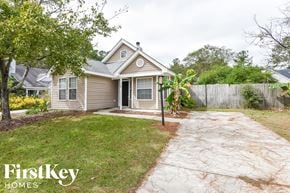 Summerville house for rent - A house with a brown roof and a grey front yard.