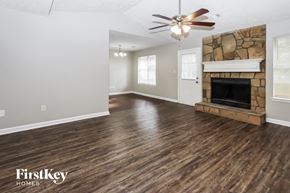 Hampton house for rent - the living room with wood flooring and a fireplace