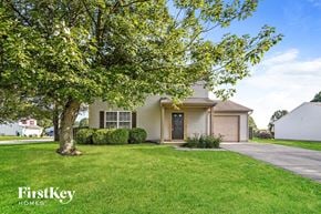 Mooresville house for rent - a house with a tree in front of it