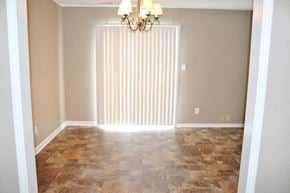 Mooresville house for rent - an empty living room with a large window and a curtain