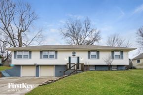 Belton house for rent - A two-story house with a garage and a driveway.