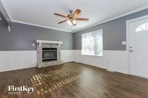 Belton house for rent - a living room with a fireplace and a ceiling fan
