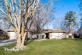 Summerville house for rent - a home with a large tree in the front yard