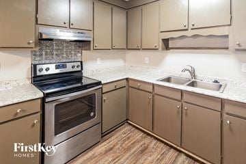 Summerville house for rent - a kitchen with granite counter tops and stainless steel appliances
