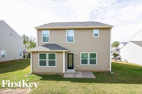 Mooresville house for rent - A house with a brown and beige exterior is for sale.