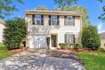 Mooresville house for rent - a white house with a white garage door