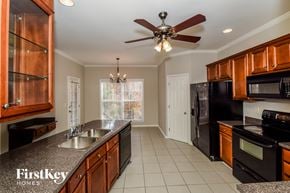 Helena house for rent - a kitchen with a sink and a ceiling fan