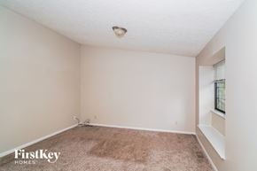 Greenwood house for rent - a room with a carpeted floor and a window