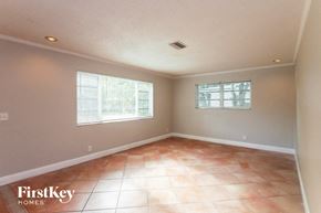 Hallandale Beach house for rent - A room with a tile floor and two windows.