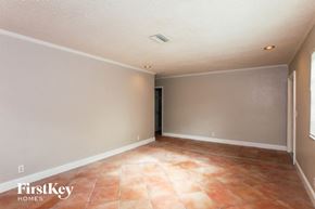 Hallandale Beach house for rent - A room with a tile floor and a door on the left side.