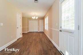 Dallas house for rent - the living room and dining room of an empty house