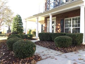 Mooresville house for rent - A house with a porch and a white railing.