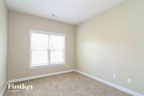 Clemmons house for rent - a bedroom with a window and a carpeted floor
