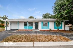 St. Petersburg house for rent - A house with a blue and white exterior is for sale.
