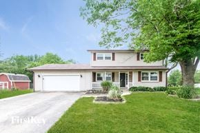 Monrovia house for rent - A two-story house with a garage and a driveway.