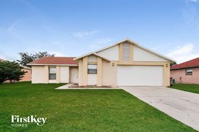 Kissimmee house for rent - A two-story house with a garage is for sale.