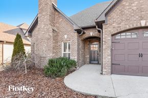 Wilsonville house for rent - standalone garage door in front of a brick house