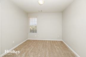 Covington house for rent - a spacious room with carpet and a window