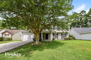 Summerville house for rent - A tree in front of a house with the words "FirstKey Homes" on the bottom left.