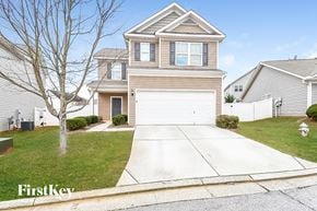 Hiram house for rent - A two-story house with a garage is for sale.