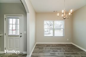 Dallas house for rent - the dining room of a new home with a white door and window