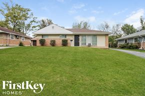 Park Forest house for rent - a house with a large lawn in front of it