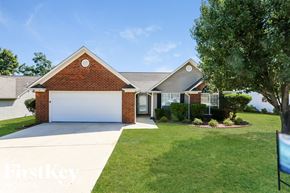 Alabaster house for rent - A house with a white garage door is for sale.