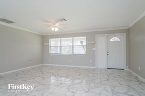 Lehigh Acres house for rent - a white and gray room with a white door and a window