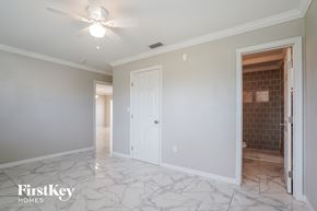 Lehigh Acres house for rent - a renovated living room with marble flooring and a white door