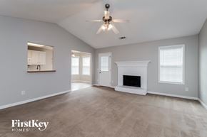 Winder house for rent - the spacious living room with fireplace and ceiling fan