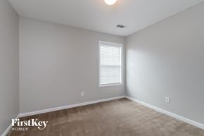 Winder house for rent - the upstairs bedroom has a carpeted floor and a window