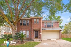 Richmond house for rent - a brick house with a tree in front of it