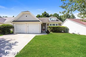 Fairburn house for rent - A house with a garage and a driveway is for sale.